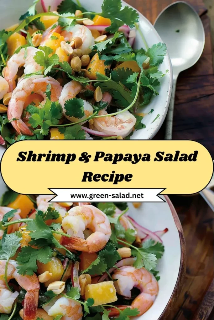 Bowl of shrimp and papaya salad with cilantro, peanuts, and red onion, served fresh as a healthy tropical dish.